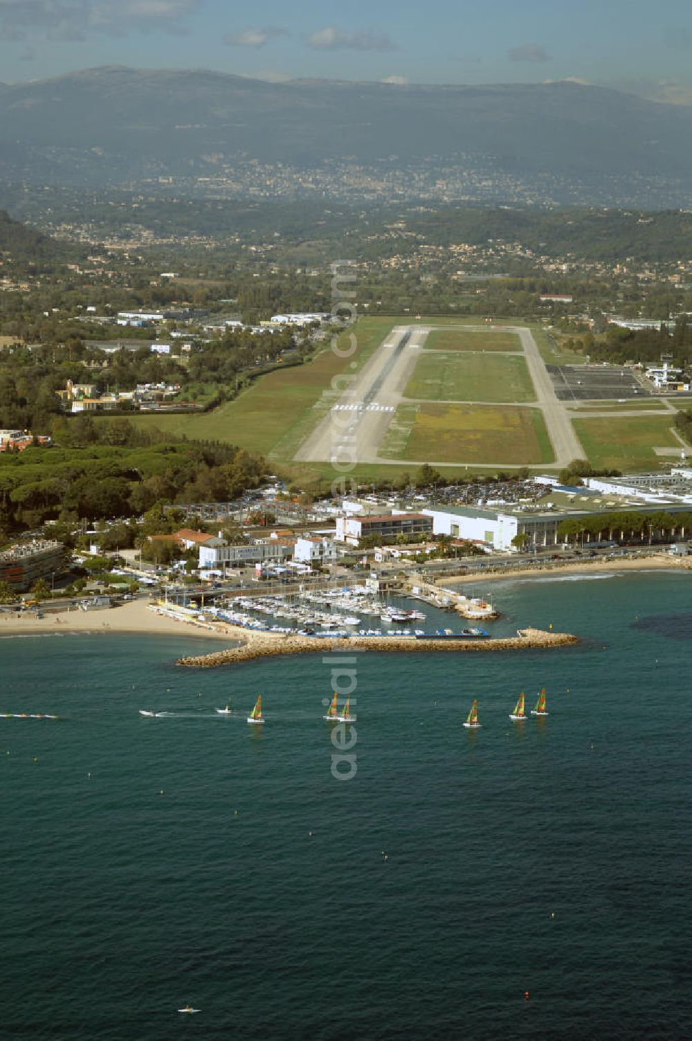 Aerial photograph Cannes - Blick auf den Flughafen Cannes - Mandelieu / Aéroport de Cannes - Mandelieu. Der Flughafen befindet sich ca 5km westlichen von Cannes, sowie östlich von Mandelieu la Napoule. International ist er weniger bedeutend, denn der Hauptflugverkehr wird im Flughafen von Nizza abgefertigt. Kontakt: Aéroport Cannes Mandelieu, Avenue Francis Tonner, 06150 Cannes, Tel. +33(0)8 20 42 66 66