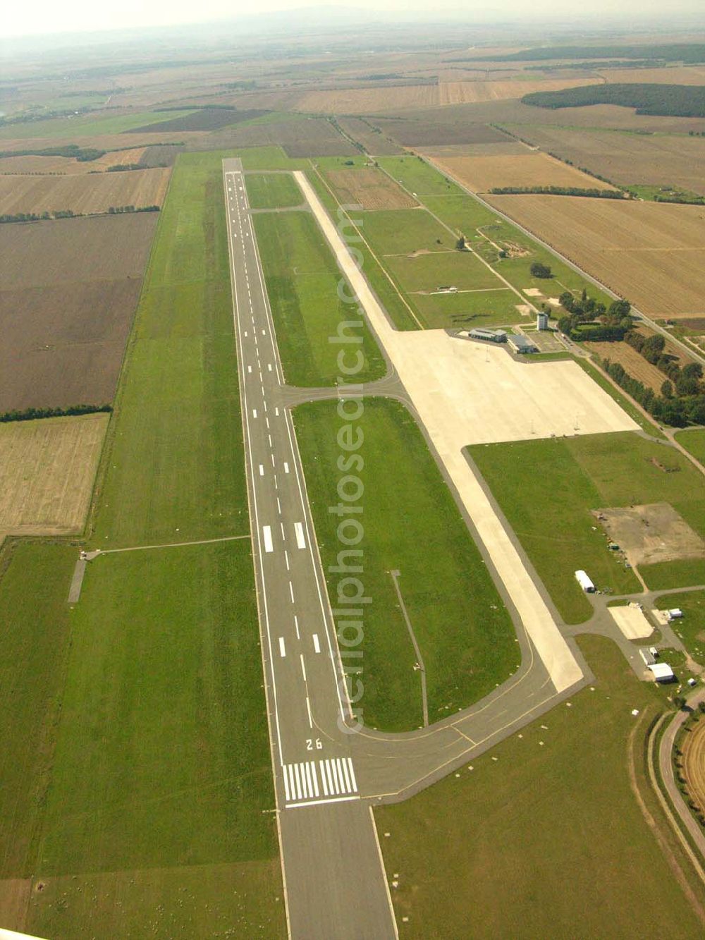 Cochstedt from above - , Der Flughafen Cochstedt bietet mit seinen Industrie- und Gewerbeflächen beste Voraussetzungen für eine hervorragende Fluganbindung für den mitteldeutschen Wirtschaftsraum sowie interessante Möglichkeiten der Ansiedlung von Industrie und Gewerbe auf den dafür vorgehaltenen Gewerbeflächen.