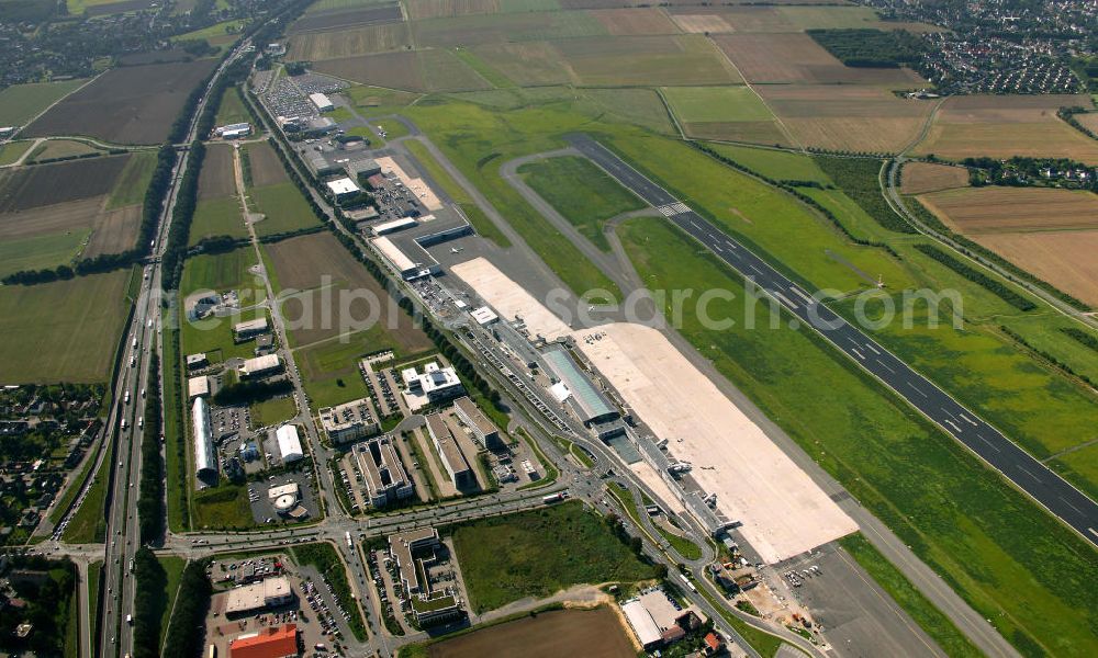 Dortmund from above - Blick auf den Flughafen Dortmund. Der Dortmund Airport 21 (IATA-Code DTM, ICAO-Code EDLW), ein ehemaliger Verkehrslandeplatz, entwickelte sich in den letzten Jahren zum drittgrößten Verkehrsflughafen in Nordrhein-Westfalen. View of the airport Dortmund. The Dortmund Airport 21 (IATA: DTM, ICAO EDLW), a former airfield, developed in recent years and is now the third largest airport in North Rhine-Westphalia.