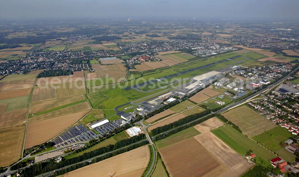 Aerial photograph Dortmund - Blick auf den Flughafen Dortmund. Der Dortmund Airport 21 (IATA-Code DTM, ICAO-Code EDLW), ein ehemaliger Verkehrslandeplatz, entwickelte sich in den letzten Jahren zum drittgrößten Verkehrsflughafen in Nordrhein-Westfalen. View of the airport Dortmund. The Dortmund Airport 21 (IATA: DTM, ICAO EDLW), a former airfield, developed in recent years and is now the third largest airport in North Rhine-Westphalia.