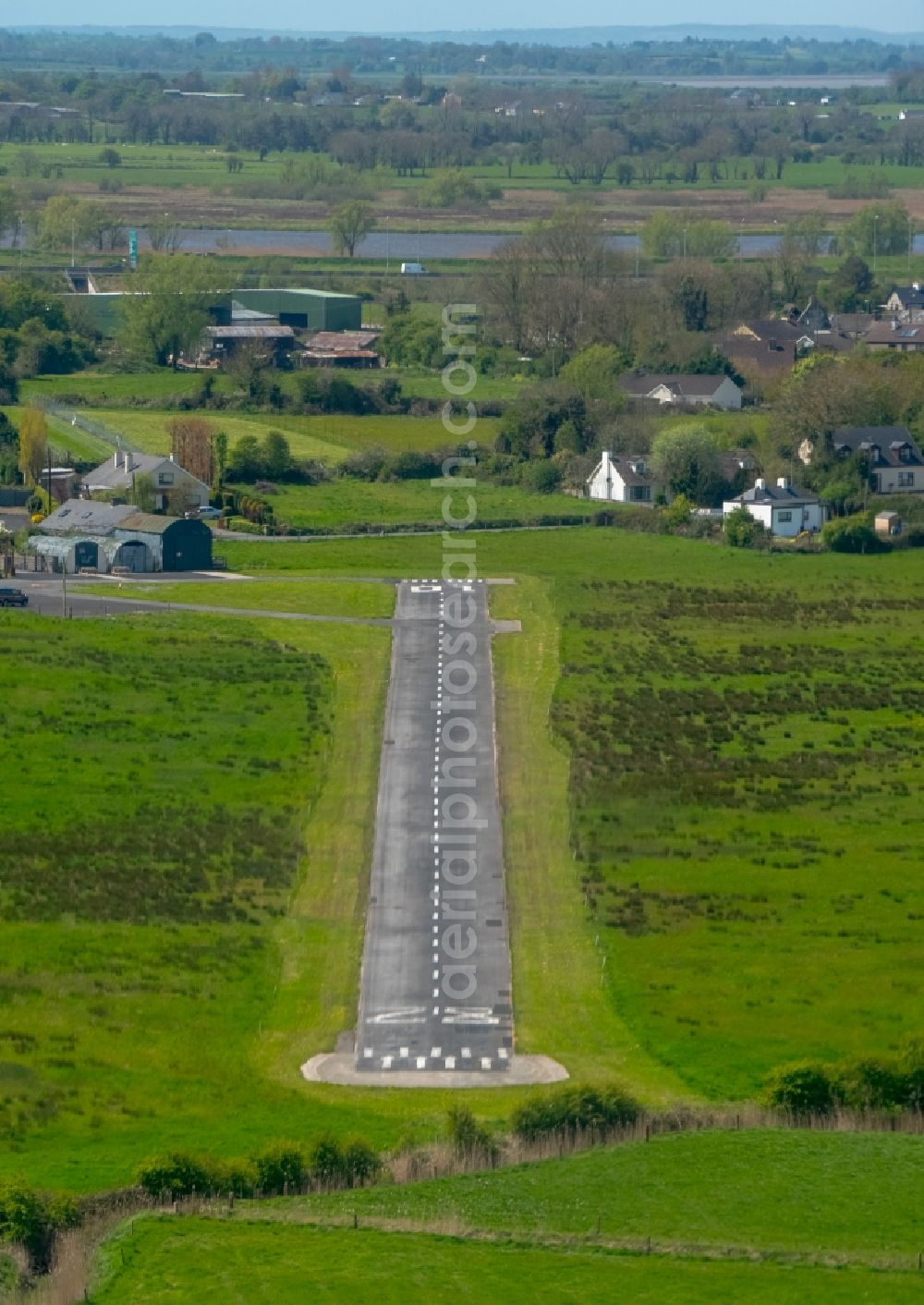 Aerial image Limerick - Runway with tarmac terrain of airfield Coonagh-Airfield in Limerick, Ireland