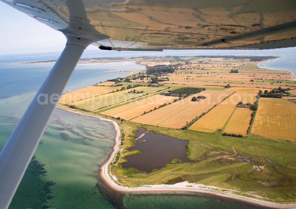 Endelave from above - Runway with tarmac terrain of airfield on the island of Endelave in Denmark