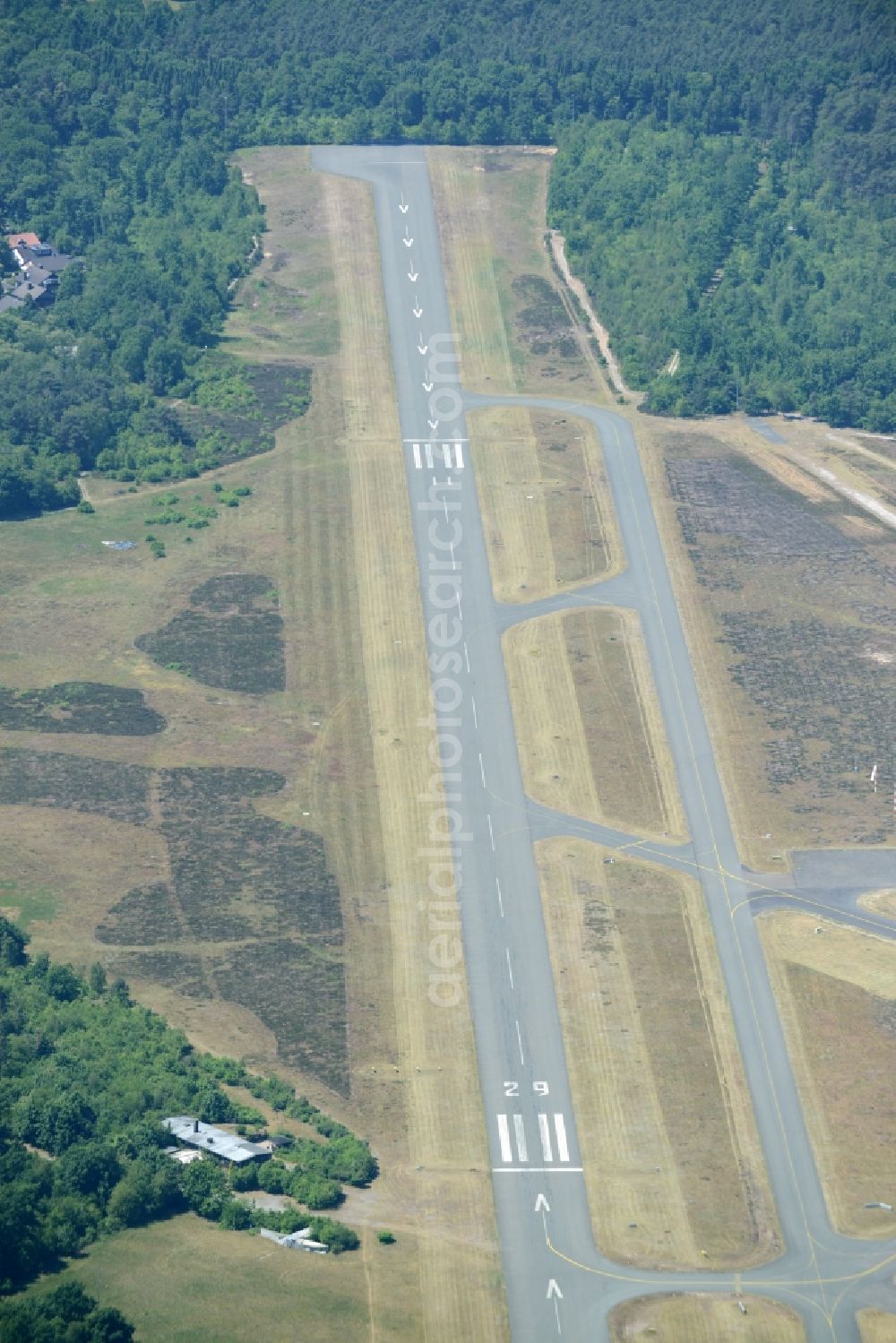 Bielefeld from above - Runway with tarmac terrain of airfield Flughafen Bielefeld GmbH in Bielefeld in the state North Rhine-Westphalia