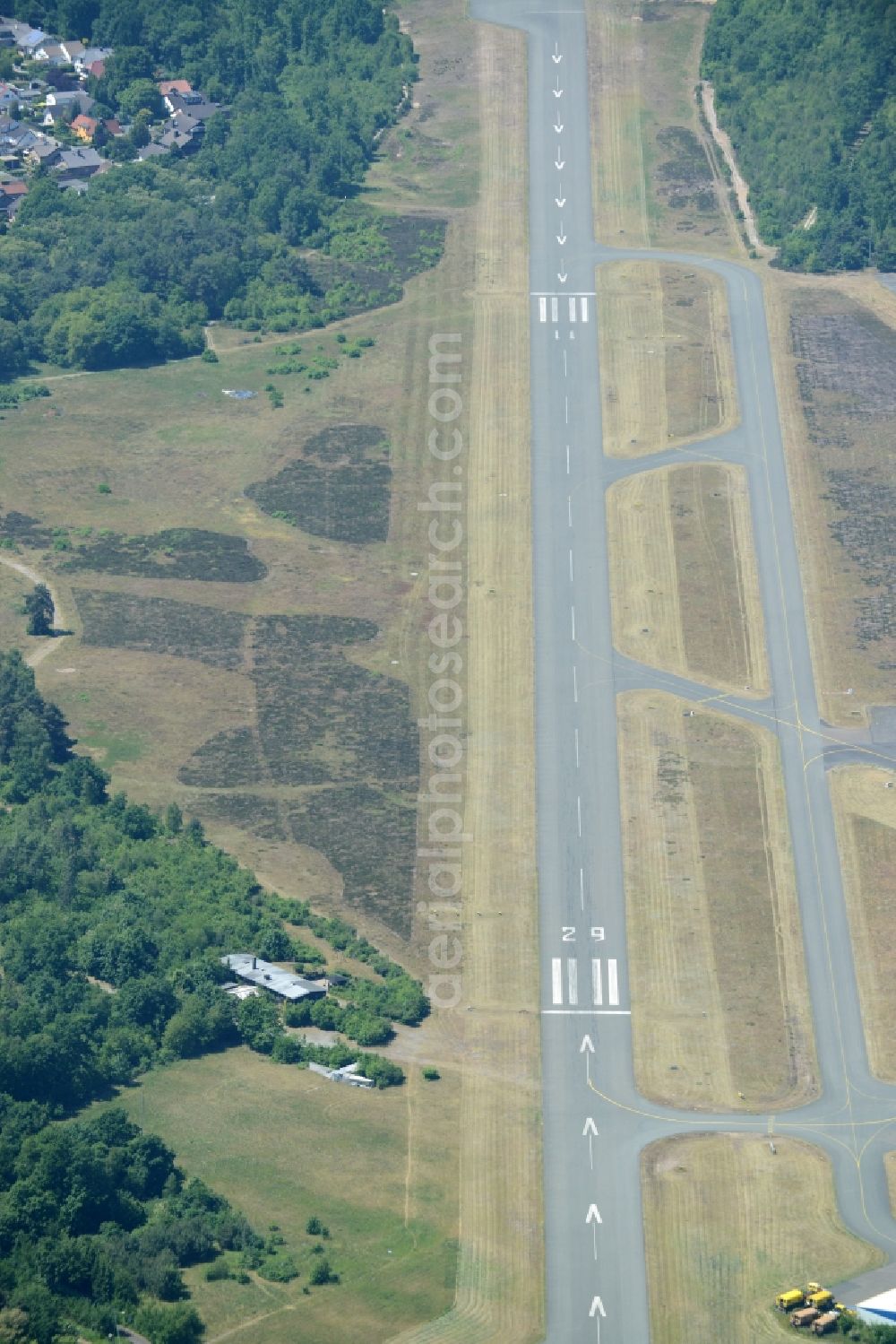 Bielefeld from the bird's eye view: Runway with tarmac terrain of airfield Flughafen Bielefeld GmbH in Bielefeld in the state North Rhine-Westphalia