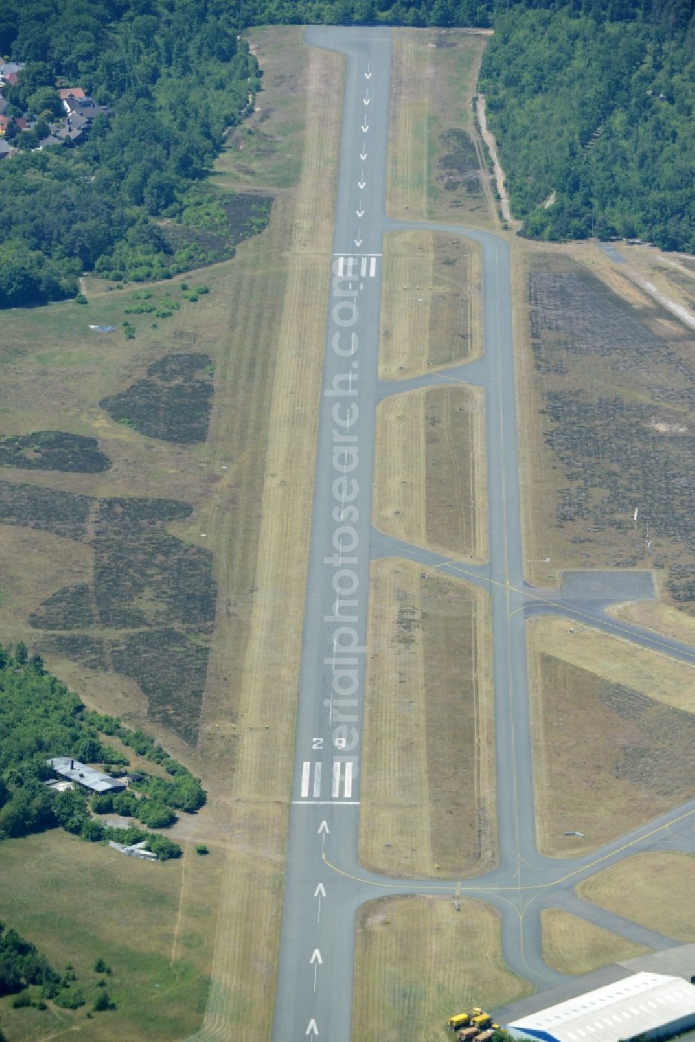 Aerial image Bielefeld - Runway with tarmac terrain of airfield Flughafen Bielefeld GmbH in Bielefeld in the state North Rhine-Westphalia