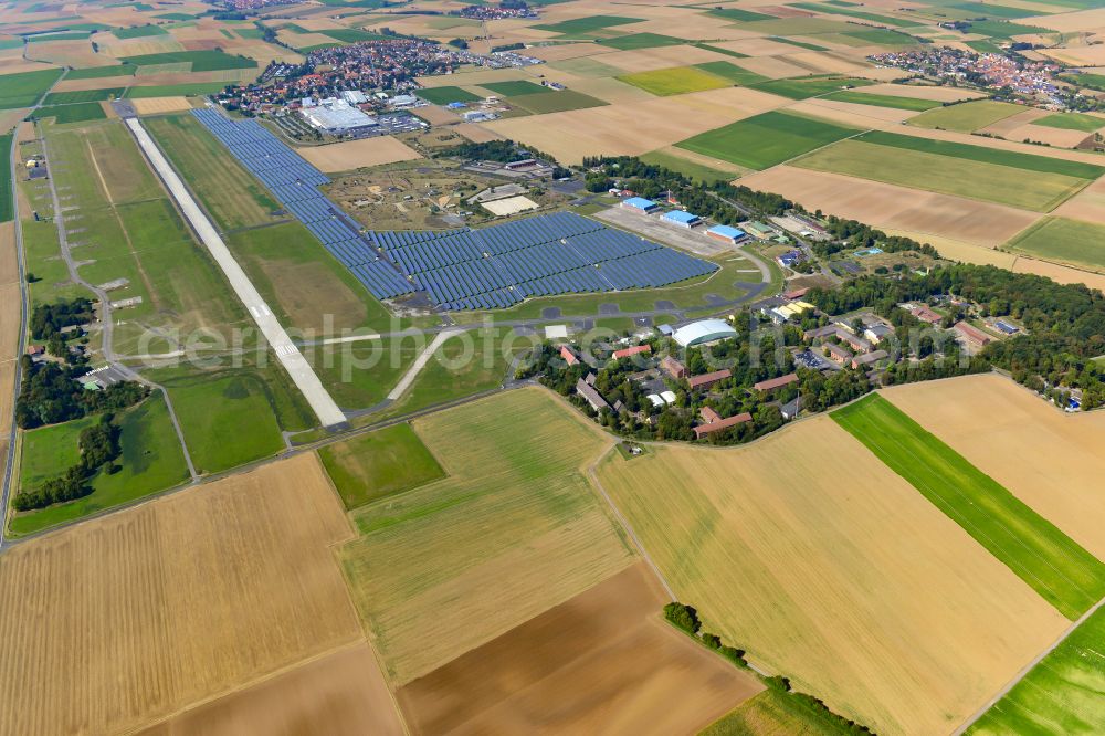 Giebelstadt from the bird's eye view: Runway with tarmac terrain of airfield in Giebelstadt in the state Bavaria, Germany