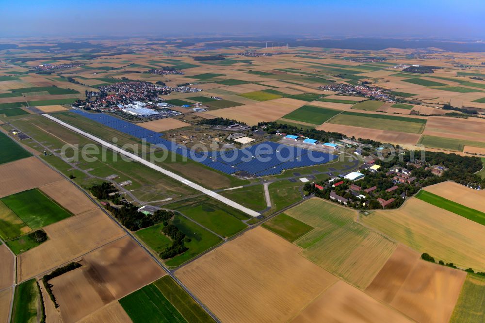 Aerial image Giebelstadt - Runway with tarmac terrain of airfield in Giebelstadt in the state Bavaria, Germany