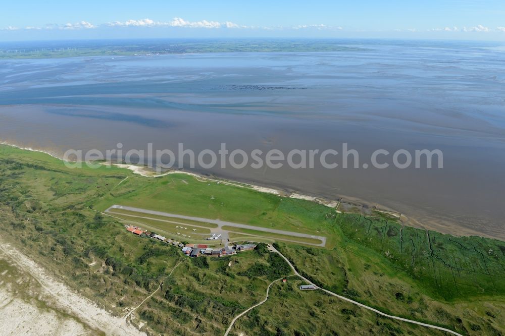 Juist from the bird's eye view: Runway with tarmac terrain of airfield Juist in the state Lower Saxony