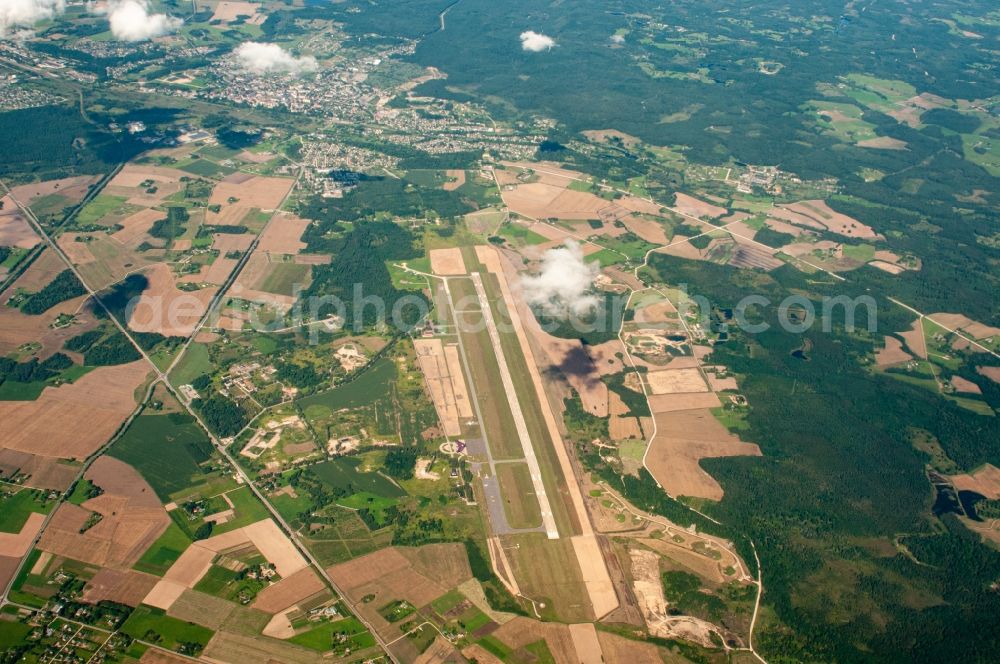 Zvirbuli from the bird's eye view: Runway with tarmac terrain of airfield Jurmala in Zvirbuli in Bezirk Engure, Latvia