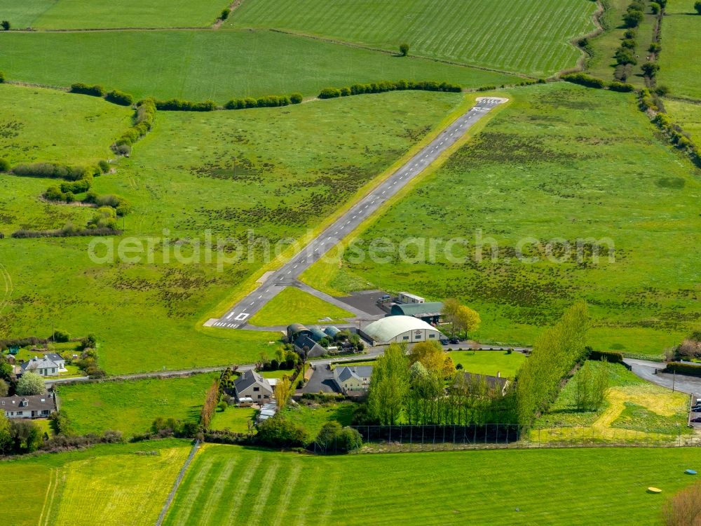 Limerick from the bird's eye view: Runway with tarmac terrain of airfield Limerick Flying Club in in Limerick, Ireland