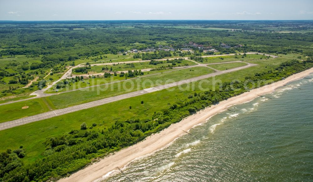 Aerial image Kolobrzeg - Kolberg - Runway with tarmac terrain of airfield Lotnisko Kolobrzeg-Bagicz on baltic sea coast in Kolberg in West Pomerania, Poland