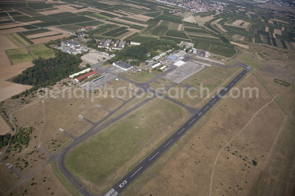 Mainz from above - Airport Mainz-Finthen in Mainz in the state of Rhineland-Palatinate. The airport in the West of the city - Frequency 122.925 (ICAO-Code EDFZ) - is a commercial airstrip without control zone. It includes a concrete runway and different halls and hangars and is surrounded by fields and meadows