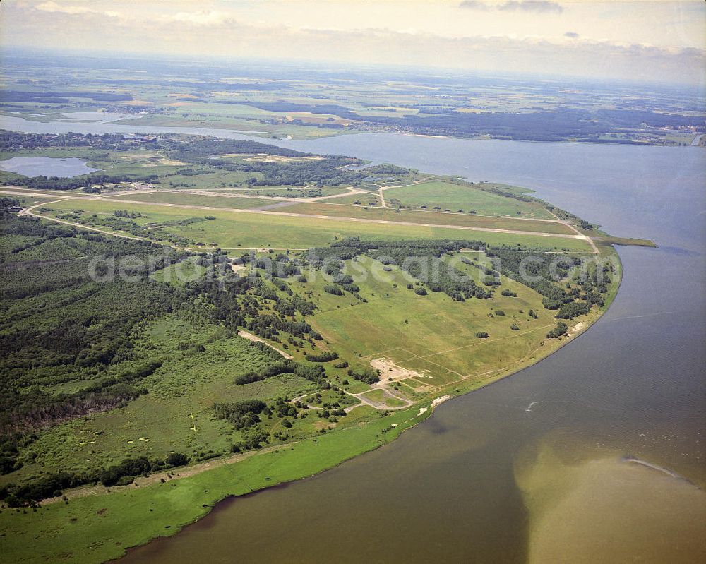 Aerial image Peenemünde - Blick auf den Flugplatz Peenemünde auf der Insel Usedom. Der heutige Sonderlandeplatz liegt nördlich von Peenemünde. Auf ihm befanden sich die Startstellen zur Erprobung der Rakete V1, sowie die Erprobungseinrichtung der dt. Luftwaffe. View of the Airfield Peenemünde on the island of Usedom. Today's special landing area is located north of Peenemünde. On it, the start sites were to test the V1 rocket, and the testing facility of the German Airforce.