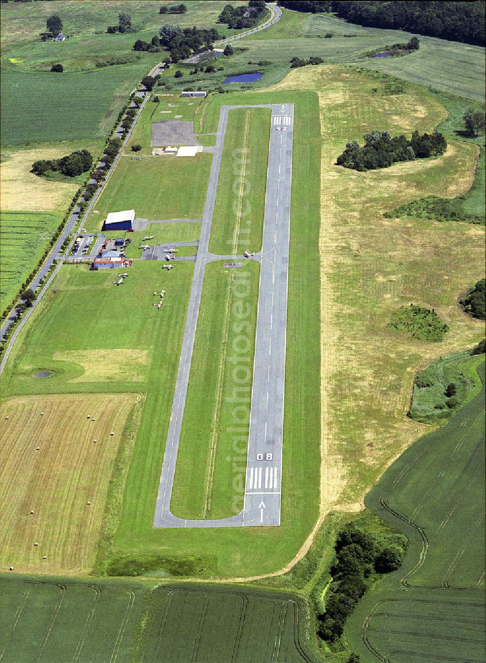 Güttin from above - Blick auf den Flugplatz Rügen - Güttin, einem ehemaligen DDR-Agrarflugplatz mit 2009 ausgebauter Piste, dem einzigen Flugplatz auf der Ostsee- Insel. View of the airfield Rügen - Güttin, a former East Germany's agricultural airfield with a runway-developed in 2009, the only airport on the Baltic island.