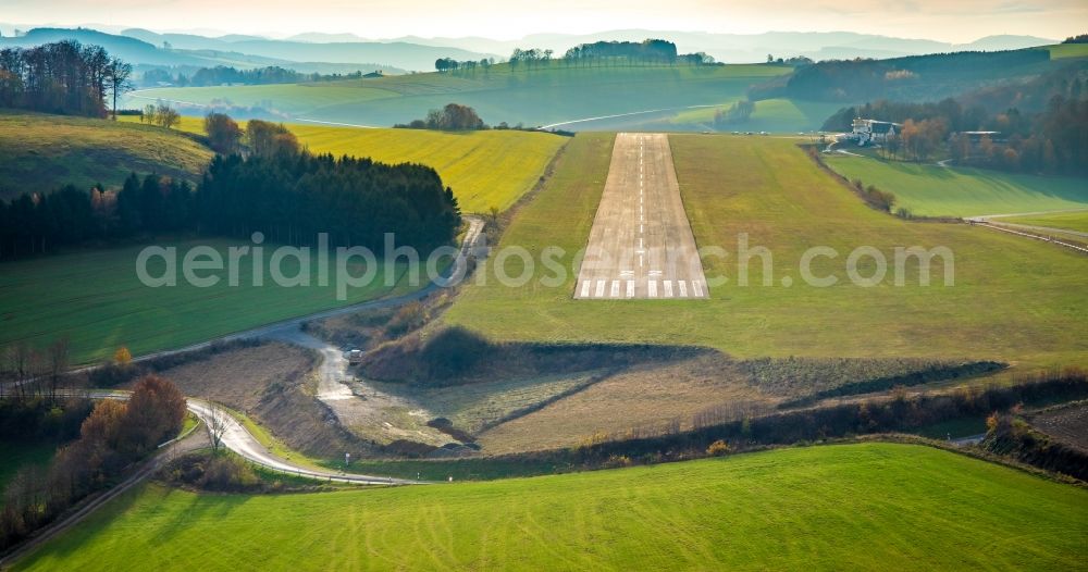 Meschede from the bird's eye view: Runway 04 with tarmac terrain of airfield in Schueren - EDKM in Meschede in the state North Rhine-Westphalia