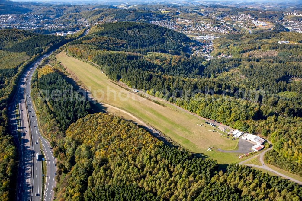 Siegen from above - Runway with tarmac terrain of airfield Siegen-Eisernhardt in Siegen in the state North Rhine-Westphalia