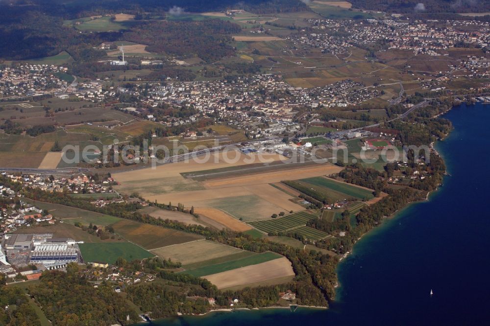 Boudry from above - Runway with tarmac terrain of airfield Neuchatel Aeroport de Neuchatel in Boudry in the canton Neuchatel, Switzerland