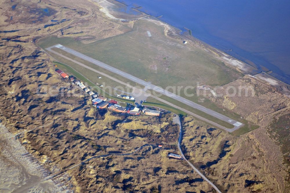 Juist from the bird's eye view: Runway with tarmac terrain of airfield in Juist in the state Lower Saxony