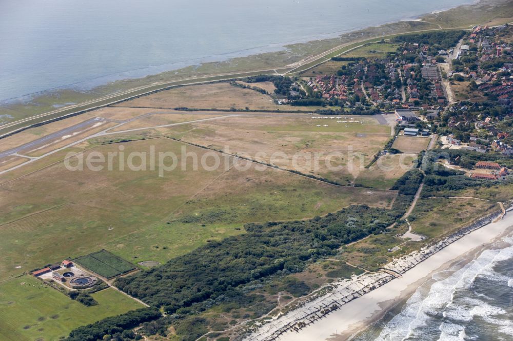 Wangerooge from above - Runway with tarmac terrain of airfield in Wangerooge in the state Lower Saxony, Germany