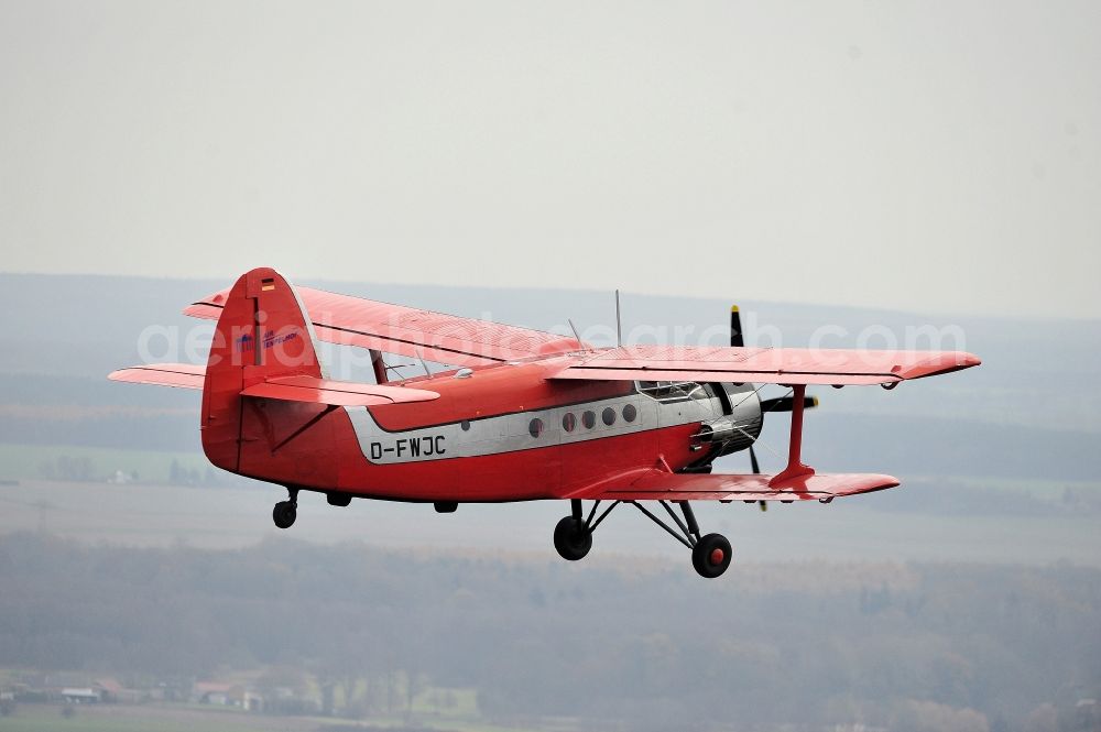 Aerial photograph Melchow - Antonow AN-2 with of Kennung D-FWJC Aircraft in flight over the airspace in Melchow in the state Brandenburg, Germany