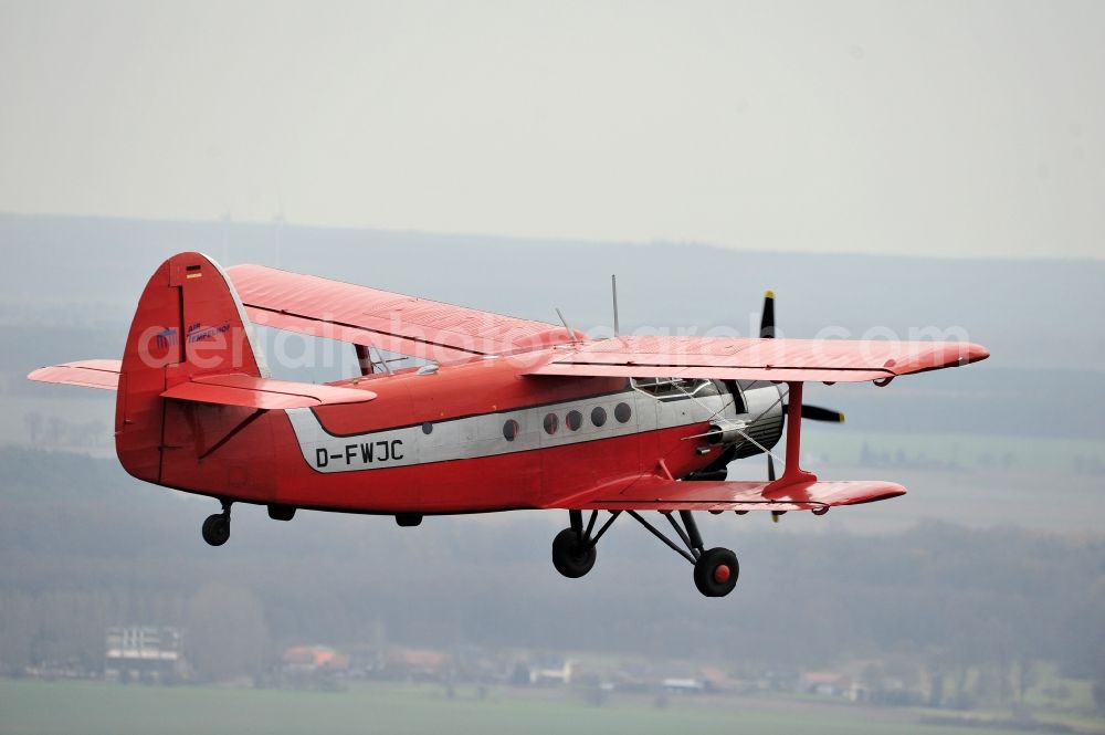 Melchow from above - Antonow AN-2 with of Kennung D-FWJC Aircraft in flight over the airspace in Melchow in the state Brandenburg, Germany