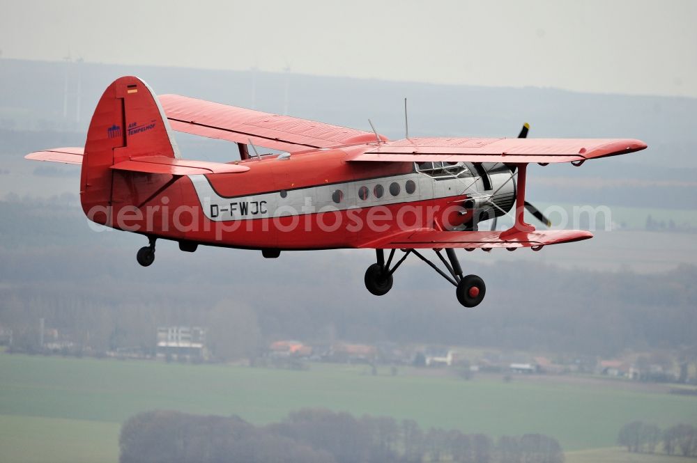 Melchow from the bird's eye view: Antonow AN-2 with of Kennung D-FWJC Aircraft in flight over the airspace in Melchow in the state Brandenburg, Germany