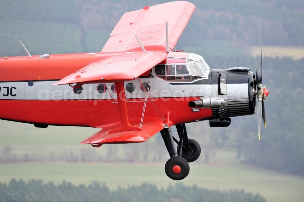 Aerial photograph Melchow - Antonow AN-2 with of Kennung D-FWJC Aircraft in flight over the airspace in Melchow in the state Brandenburg, Germany