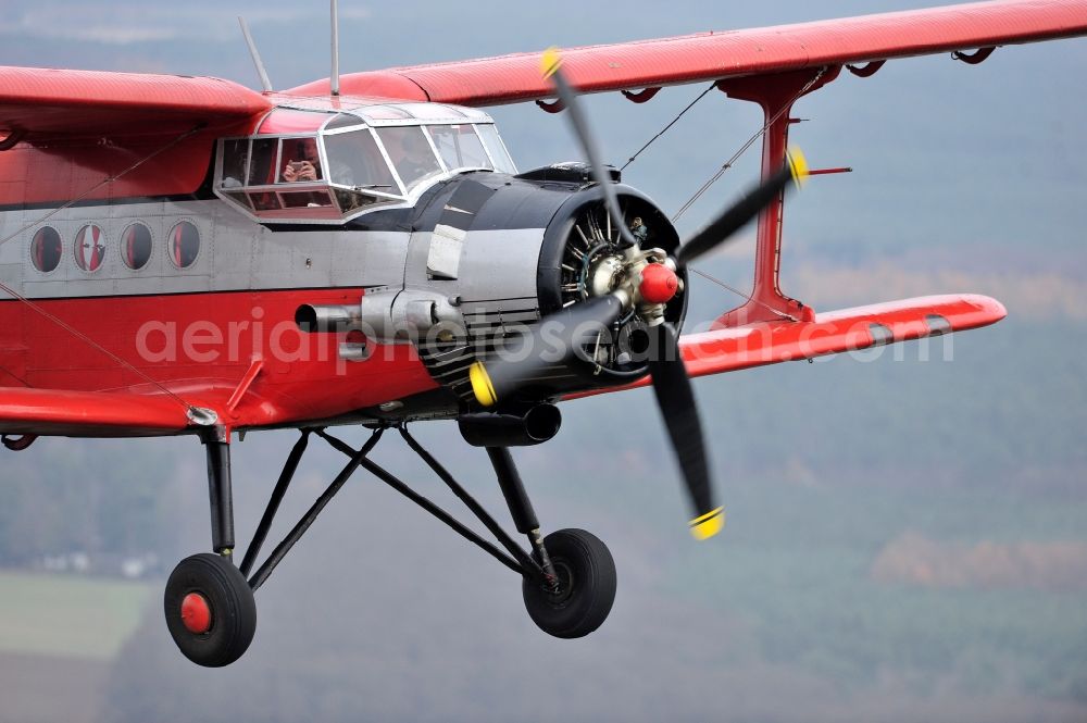 Melchow from above - Antonow AN-2 with of Kennung D-FWJC Aircraft in flight over the airspace in Melchow in the state Brandenburg, Germany