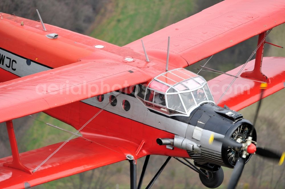 Melchow from the bird's eye view: Antonow AN-2 with of Kennung D-FWJC Aircraft in flight over the airspace in Melchow in the state Brandenburg, Germany