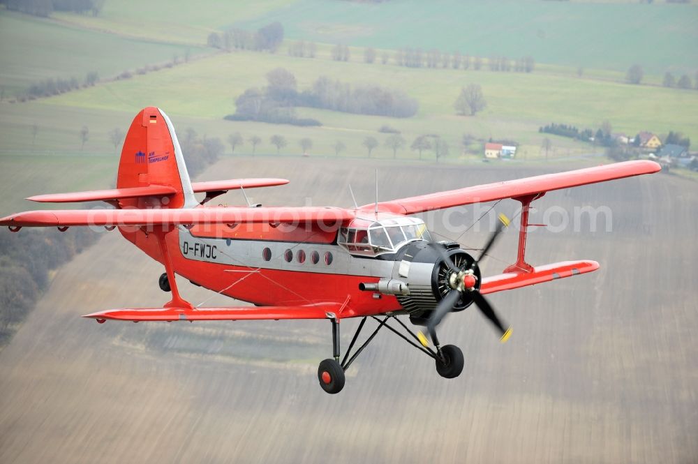 Aerial image Melchow - Antonow AN-2 with of Kennung D-FWJC Aircraft in flight over the airspace in Melchow in the state Brandenburg, Germany