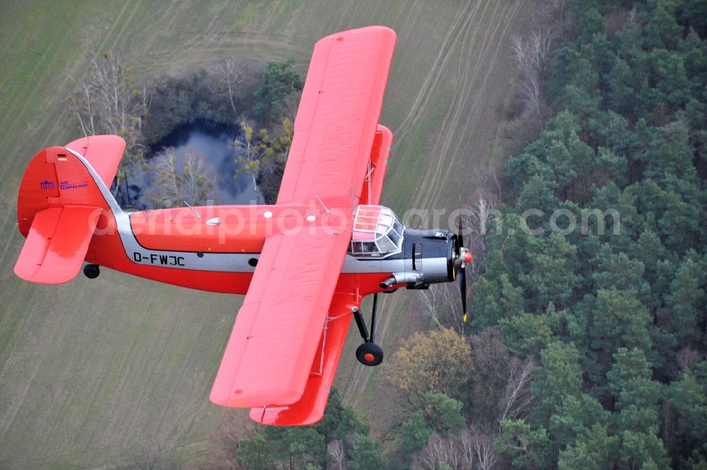 Aerial photograph Melchow - Antonow AN-2 with of Kennung D-FWJC Aircraft in flight over the airspace in Melchow in the state Brandenburg, Germany