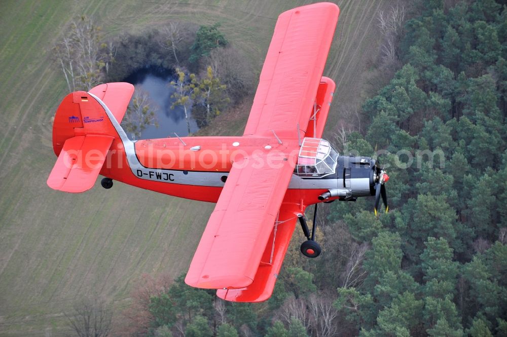 Melchow from above - Antonow AN-2 with of Kennung D-FWJC Aircraft in flight over the airspace in Melchow in the state Brandenburg, Germany