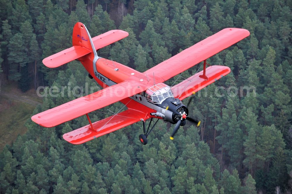 Aerial photograph Melchow - Antonow AN-2 with of Kennung D-FWJC Aircraft in flight over the airspace in Melchow in the state Brandenburg, Germany