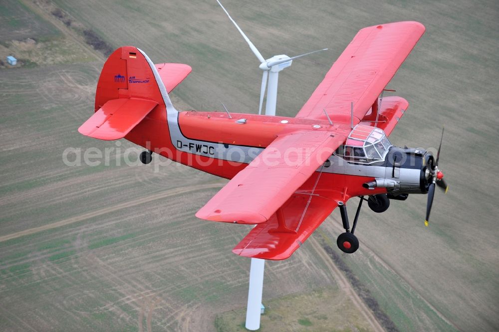 Aerial photograph Melchow - Antonow AN-2 with of Kennung D-FWJC Aircraft in flight over the airspace in Melchow in the state Brandenburg, Germany