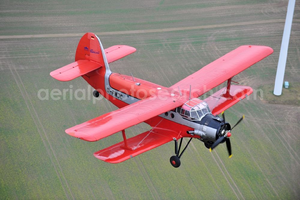 Melchow from above - Antonow AN-2 with of Kennung D-FWJC Aircraft in flight over the airspace in Melchow in the state Brandenburg, Germany