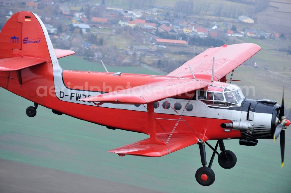 Aerial photograph Melchow - Antonow AN-2 with of Kennung D-FWJC Aircraft in flight over the airspace in Melchow in the state Brandenburg, Germany