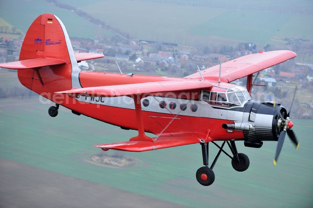 Melchow from above - Antonow AN-2 with of Kennung D-FWJC Aircraft in flight over the airspace in Melchow in the state Brandenburg, Germany