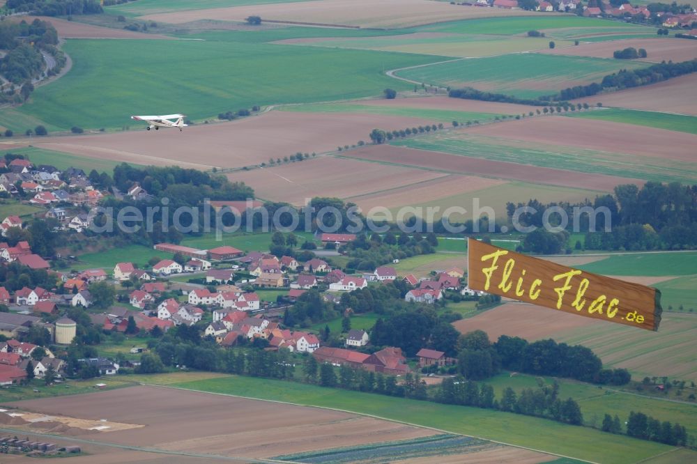 Göttingen from the bird's eye view: Aviat Husky Aircraft banner towing over the airspace in Goettingen in the state Lower Saxony