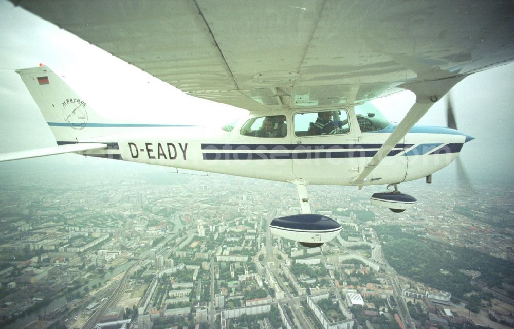 Berlin from the bird's eye view: Cessna 172 with the call sign D-EADY Aircraft in flight over the airspace in Berlin, Germany