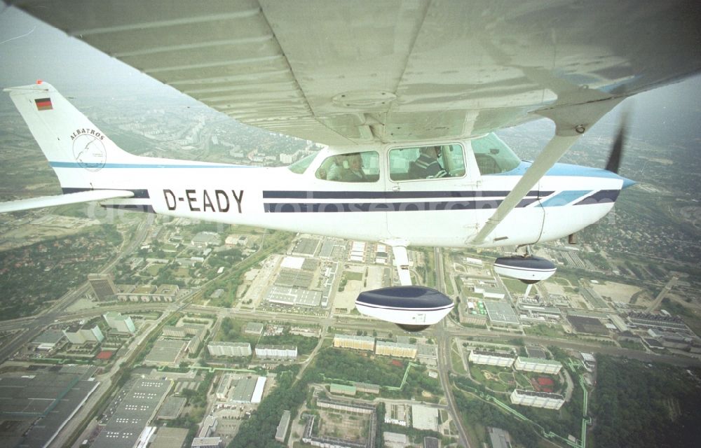 Aerial photograph Berlin - Cessna 172 with the call sign D-EADY Aircraft in flight over the airspace in Berlin, Germany