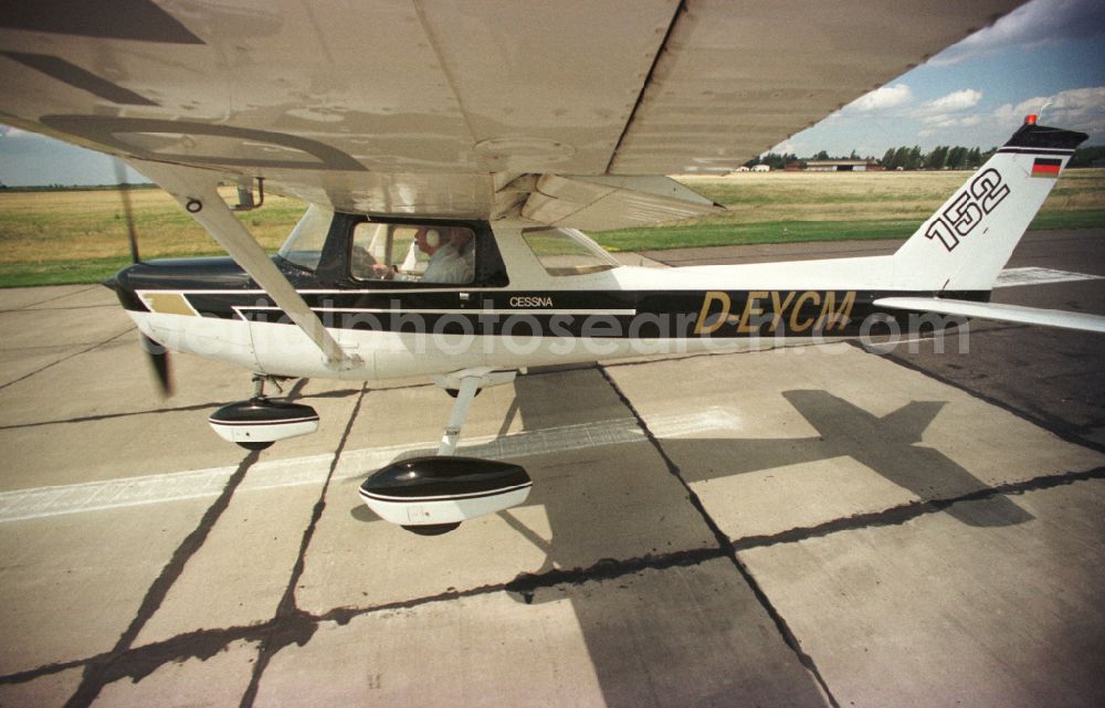 Aerial photograph Strausberg - Airplane Cessna 152 with the registration D-EYCM taking off from the airfield in Strausberg in the state Brandenburg, Germany