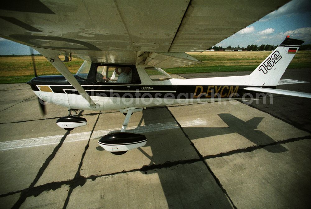 Aerial photograph Strausberg - Airplane Cessna 152 with the registration D-EYCM taking off from the airfield in Strausberg in the state Brandenburg, Germany