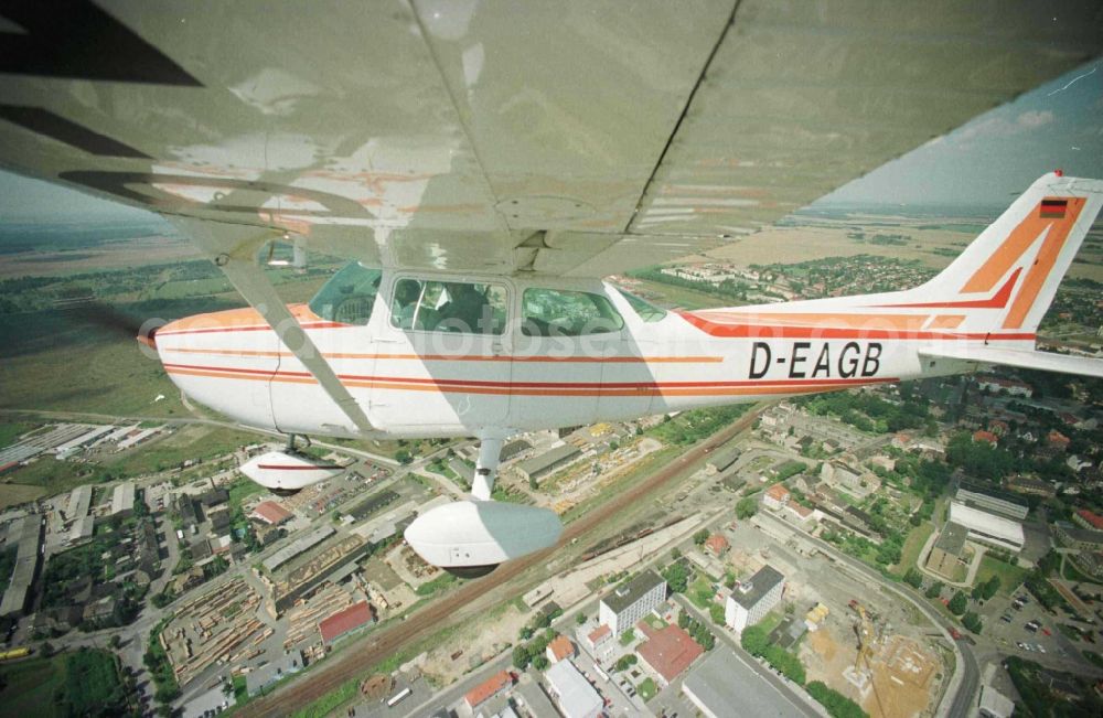 Aerial photograph Grimma - Cessna 172 with the identifier D-EAGB Aircraft in flight over the airspace in Grimma in the state Saxony, Germany