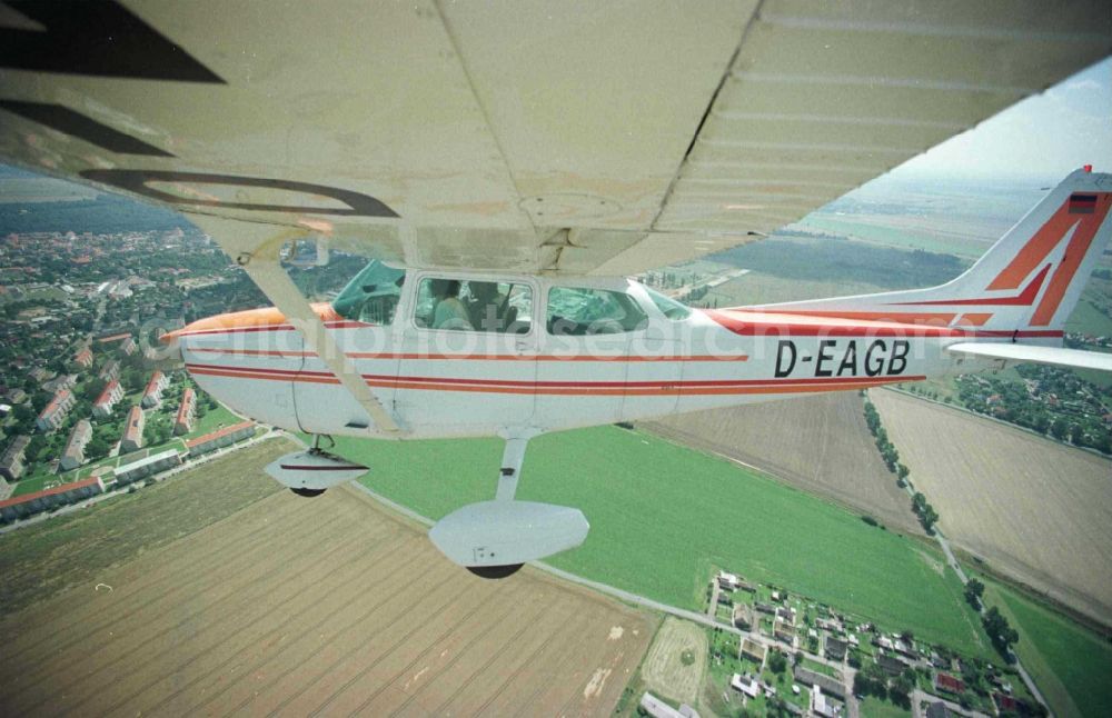 Grimma from the bird's eye view: Cessna 172 with the identifier D-EAGB Aircraft in flight over the airspace in Grimma in the state Saxony, Germany