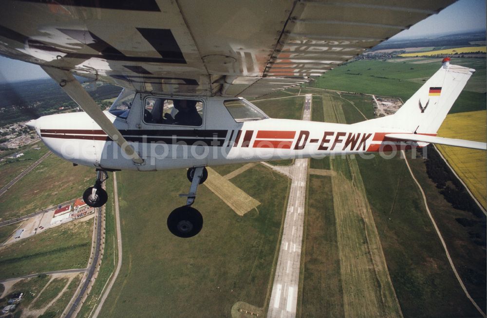 Strausberg from the bird's eye view: Cessna 150 D-EFWK Aircraft in flight over the airspace in Strausberg in the state Brandenburg, Germany