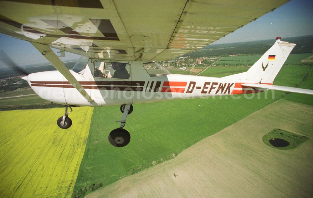 Strausberg from the bird's eye view: Cessna 150 D-EFWK Aircraft in flight over the airspace in Strausberg in the state Brandenburg, Germany