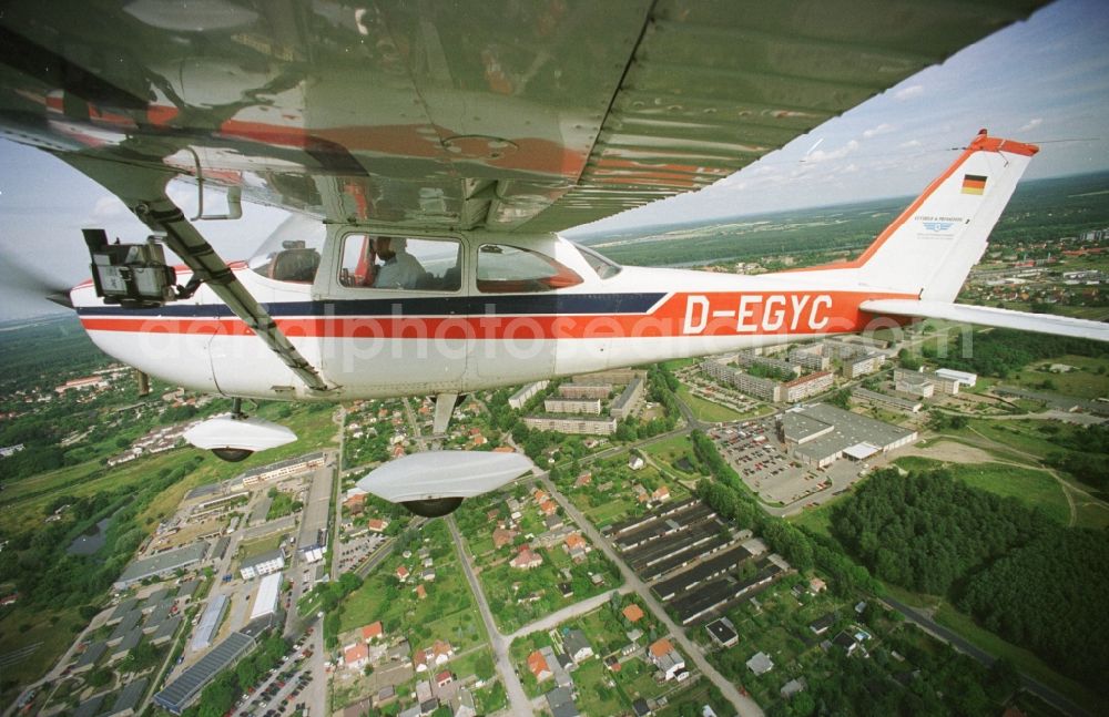 Strausberg from the bird's eye view: Cessna 172 with the identifier D-EGYC Aircraft in flight over the airspace in Strausberg in the state Brandenburg, Germany