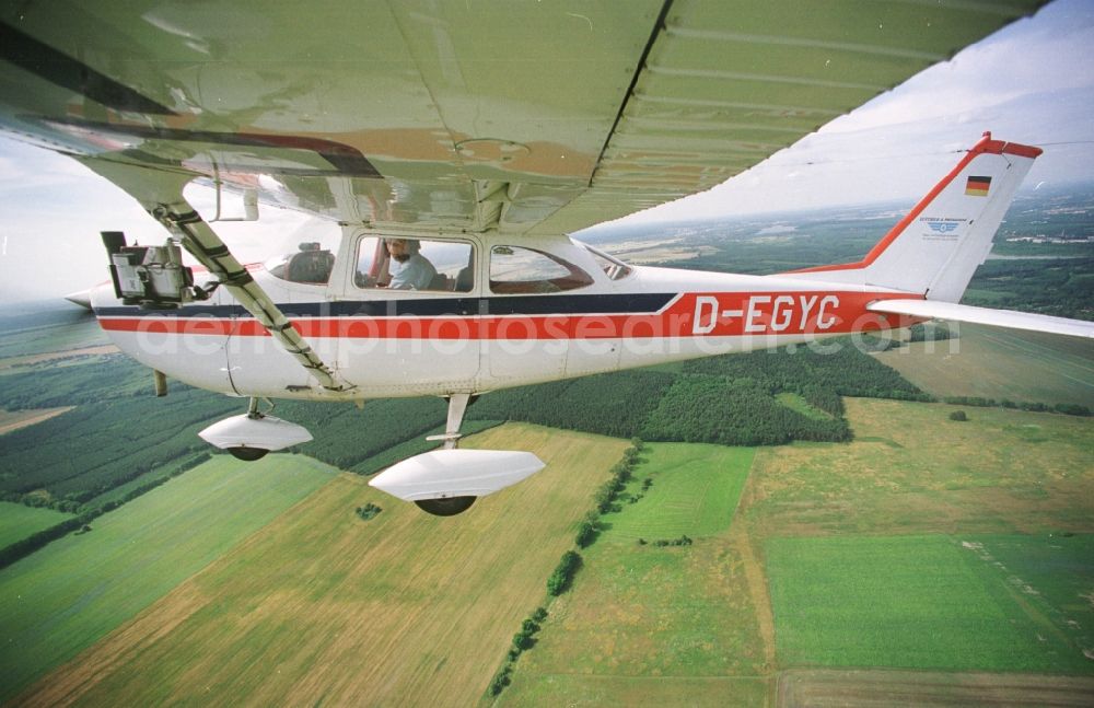 Strausberg from the bird's eye view: Cessna 172 with the identifier D-EGYC Aircraft in flight over the airspace in Strausberg in the state Brandenburg, Germany