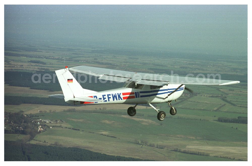 Strausberg from the bird's eye view: Cessna 150 D-EFWK Aircraft in flight over the airspace in Strausberg in the state Brandenburg, Germany