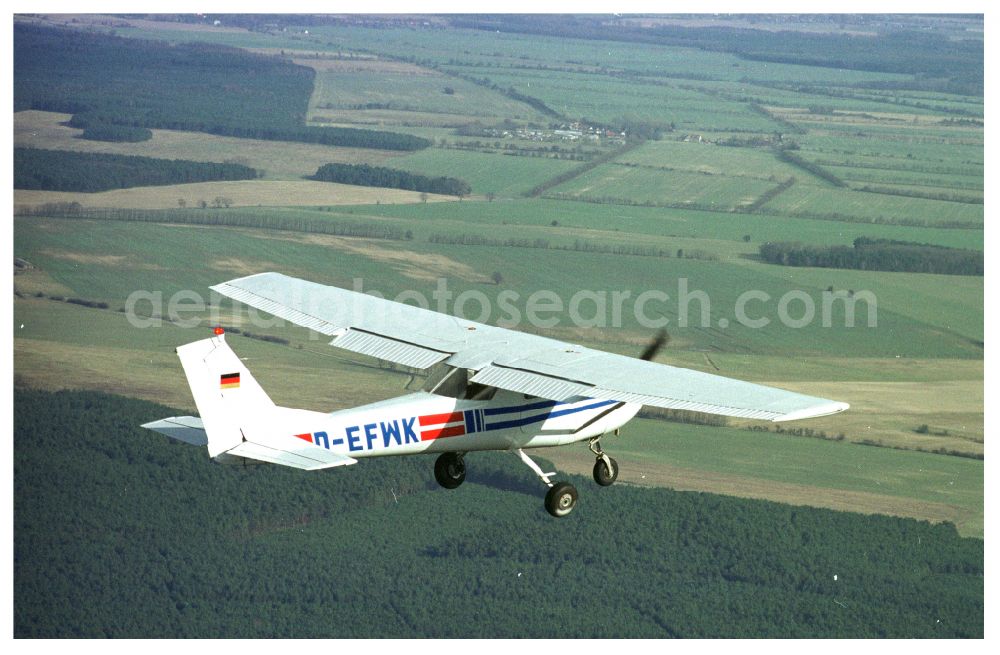 Strausberg from the bird's eye view: Cessna 150 D-EFWK Aircraft in flight over the airspace in Strausberg in the state Brandenburg, Germany